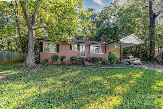 single story home with a front yard and a carport