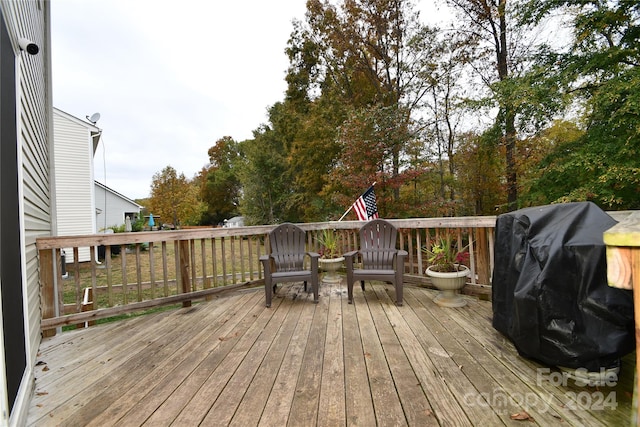 wooden deck with grilling area