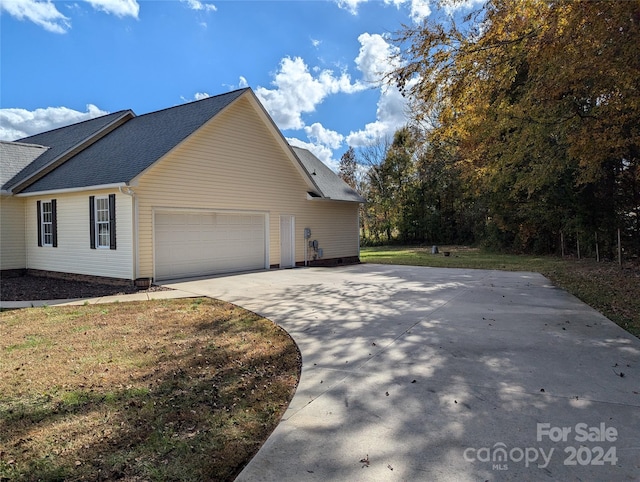 view of side of property featuring a garage