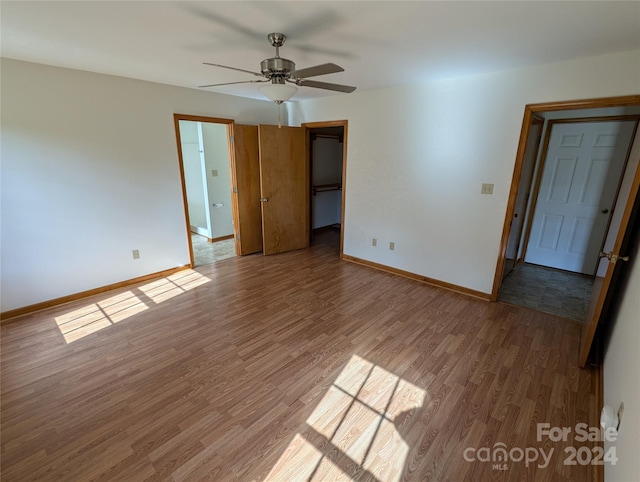 interior space featuring hardwood / wood-style floors and ceiling fan