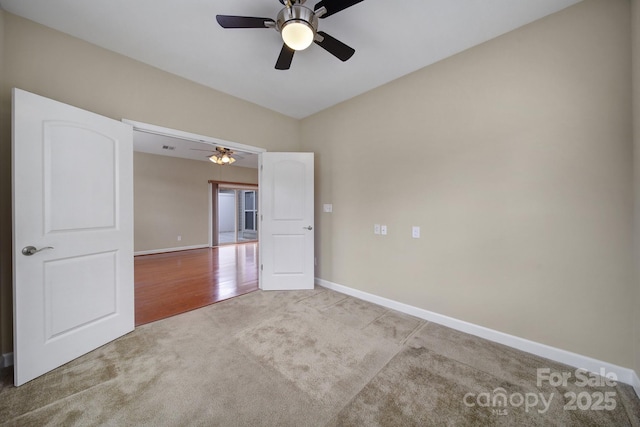 4919 Polo Gate Blvd, Charlotte, NC 28216 - carpeted spare room featuring a ceiling fan and baseboards
