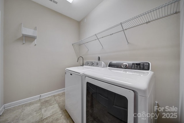 4919 Polo Gate Blvd, Charlotte, NC 28216 - laundry area featuring washing machine and clothes dryer and baseboards
