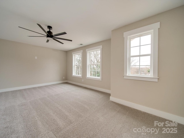 carpeted empty room with ceiling fan