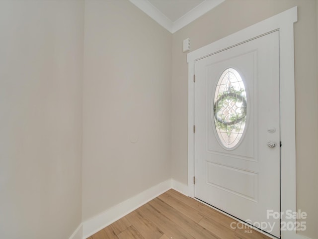 foyer entrance featuring ornamental molding and light wood-type flooring