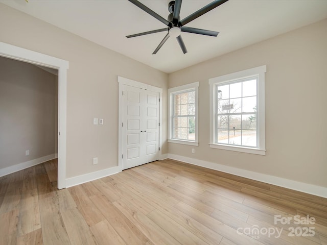 unfurnished bedroom featuring ceiling fan and light hardwood / wood-style floors