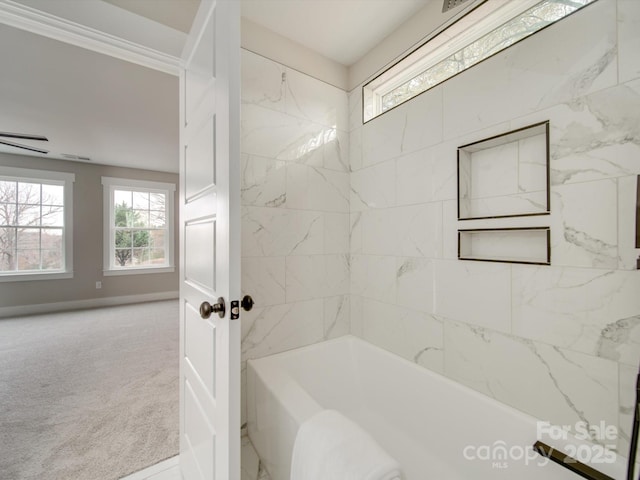 bathroom featuring tiled shower / bath combo