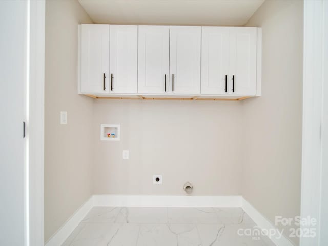 washroom featuring cabinets, electric dryer hookup, and hookup for a washing machine