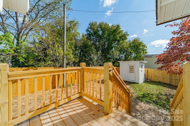 wooden deck featuring a shed