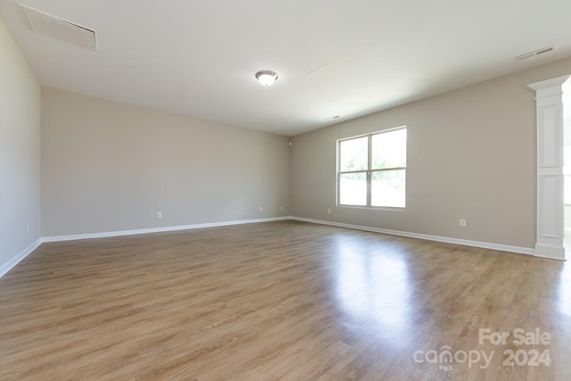 unfurnished room featuring light hardwood / wood-style flooring