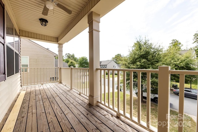 wooden terrace featuring ceiling fan