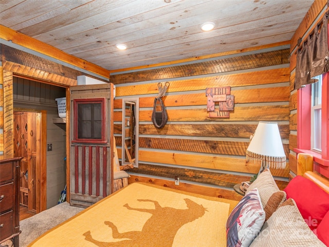 bedroom featuring wood ceiling, wooden walls, and carpet