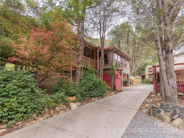 view of property exterior with a deck