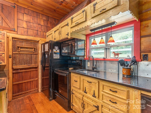 kitchen with wooden ceiling, a sink, light wood-style floors, black appliances, and hanging light fixtures