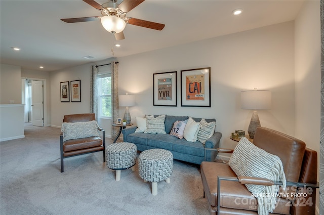 living room with light carpet and ceiling fan