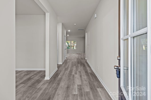 corridor featuring light hardwood / wood-style floors