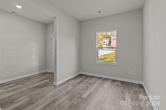 spare room with light hardwood / wood-style flooring