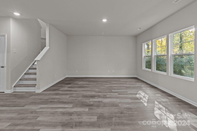1403 Gentry Pl, Salisbury, NC 28146 - unfurnished room featuring recessed lighting, baseboards, wood finished floors, and stairs