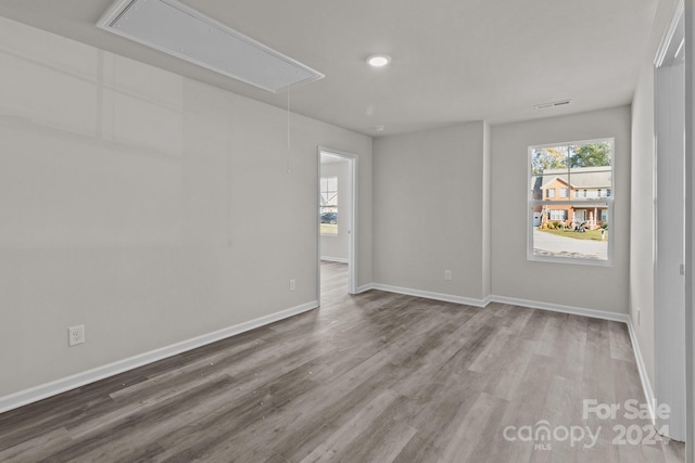 1403 Gentry Pl, Salisbury, NC 28146 - spare room with attic access, wood finished floors, and baseboards