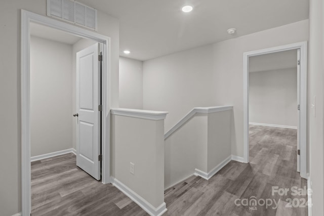 corridor with light hardwood / wood-style flooring