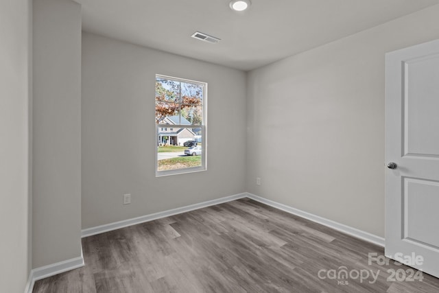 unfurnished room featuring wood-type flooring