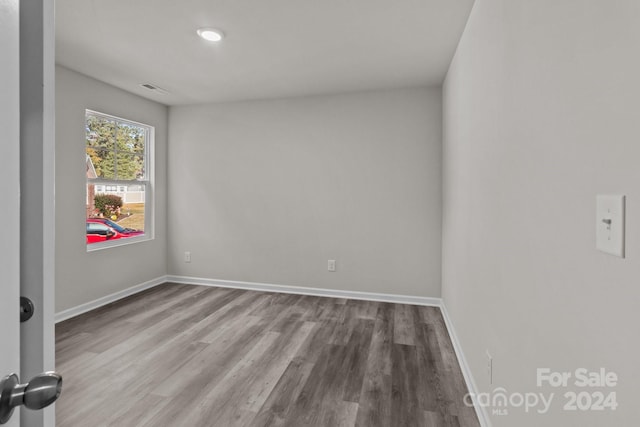 empty room featuring hardwood / wood-style flooring