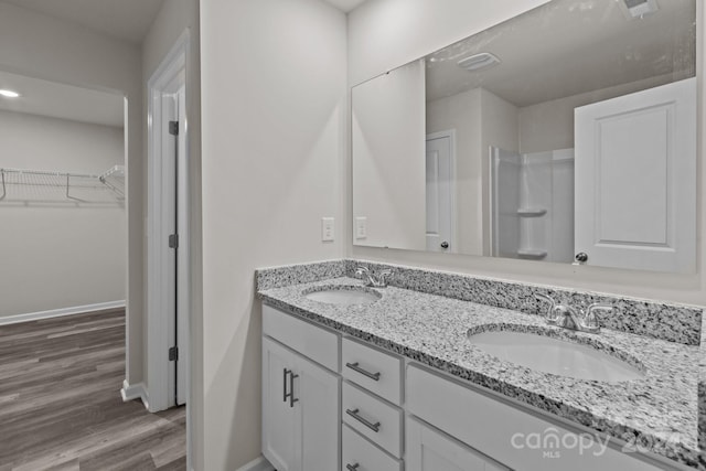 bathroom featuring vanity and hardwood / wood-style flooring