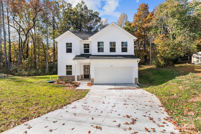 view of front property with a front yard and a garage