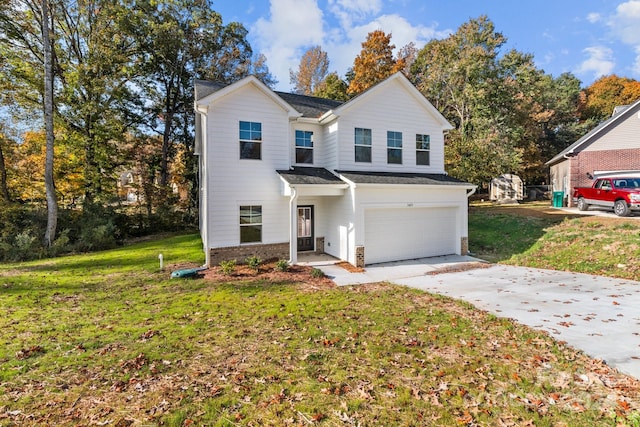 view of front property with a front lawn and a garage