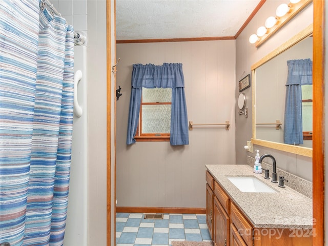 bathroom featuring wood walls, walk in shower, ornamental molding, a textured ceiling, and vanity