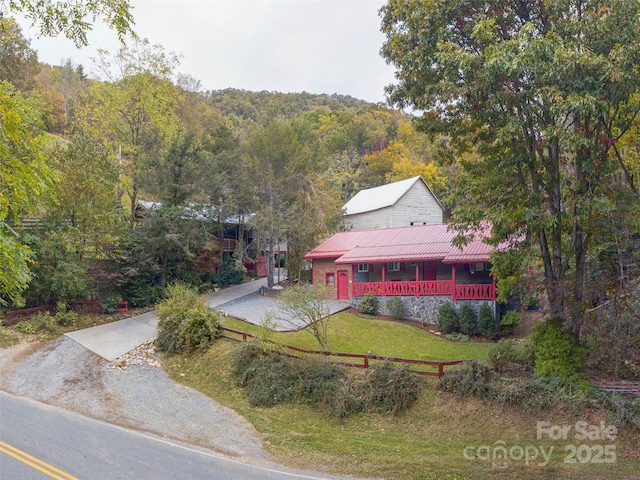 birds eye view of property with a forest view