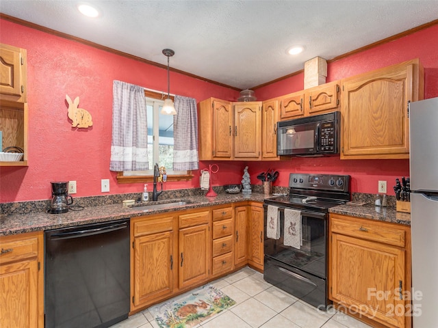 kitchen with a sink, a textured ceiling, black appliances, light tile patterned floors, and ornamental molding