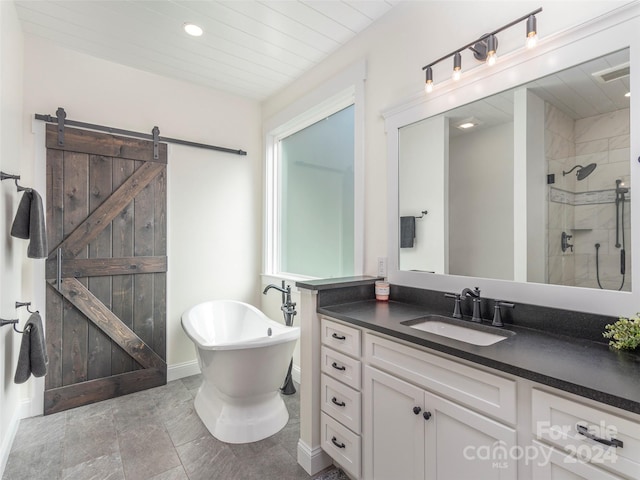 bathroom with vanity and shower with separate bathtub