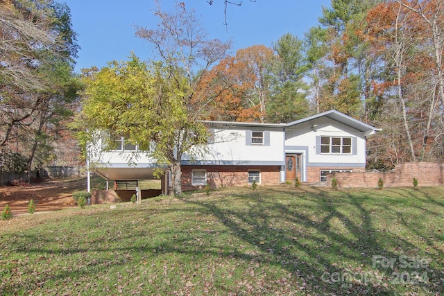 raised ranch with a front lawn