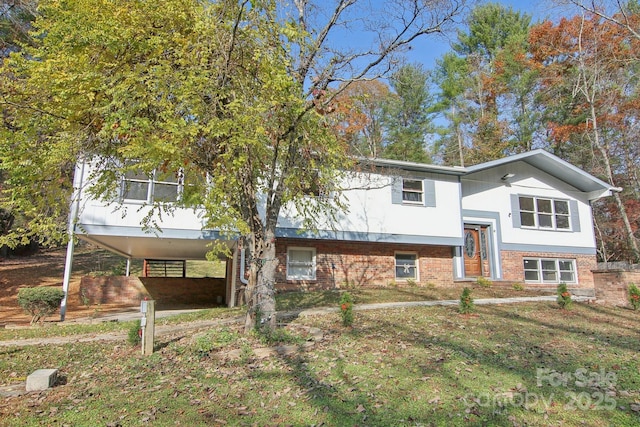 821 Anne Ave W, Hendersonville, NC 28739 - view of front of home featuring brick siding and a carport