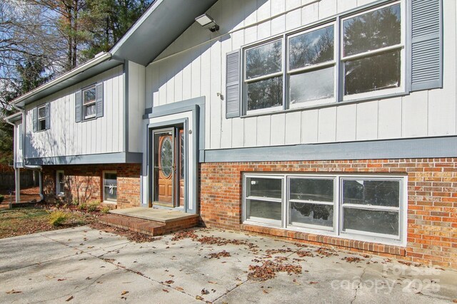 821 Anne Ave W, Hendersonville, NC 28739 - view of front of house featuring a patio area and brick siding