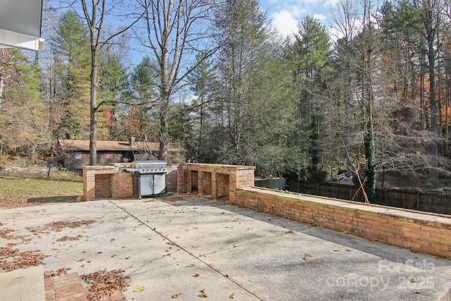 821 Anne Ave W, Hendersonville, NC 28739 - view of patio featuring a grill and fence