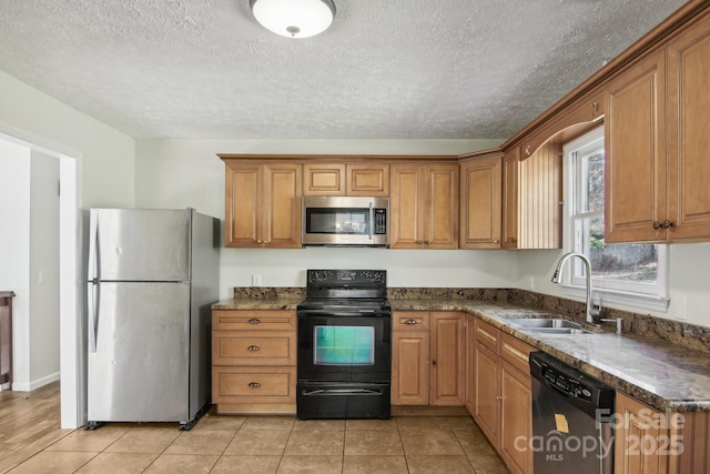 821 Anne Ave W, Hendersonville, NC 28739 - kitchen with stainless steel appliances, a sink, brown cabinetry, a textured ceiling, and light tile patterned floors