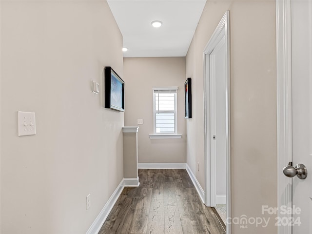 hallway with wood-type flooring