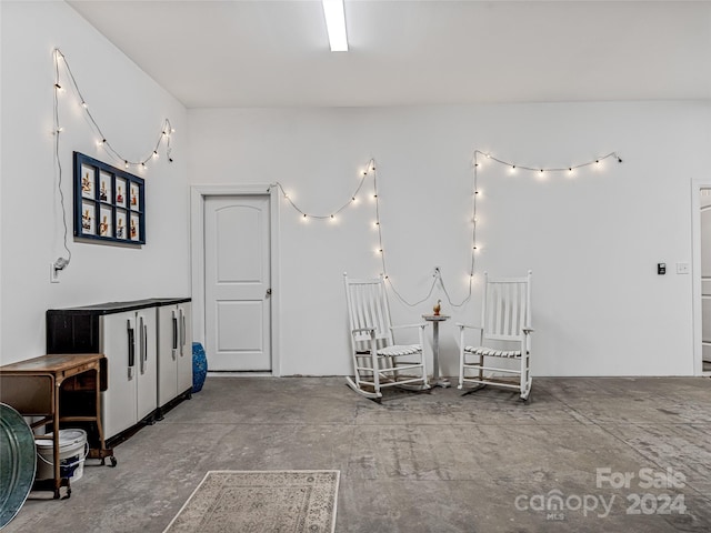 sitting room with concrete floors