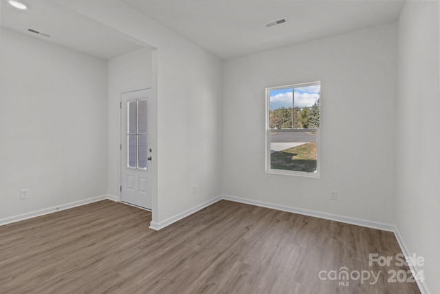 empty room featuring hardwood / wood-style floors