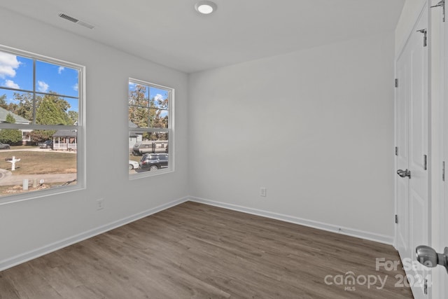 spare room featuring hardwood / wood-style floors