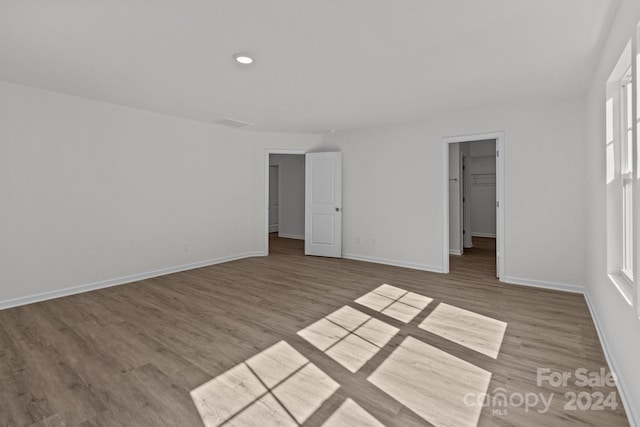 unfurnished room with hardwood / wood-style floors