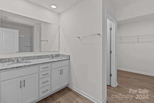 bathroom featuring vanity and hardwood / wood-style flooring