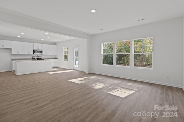 unfurnished living room featuring light wood-type flooring