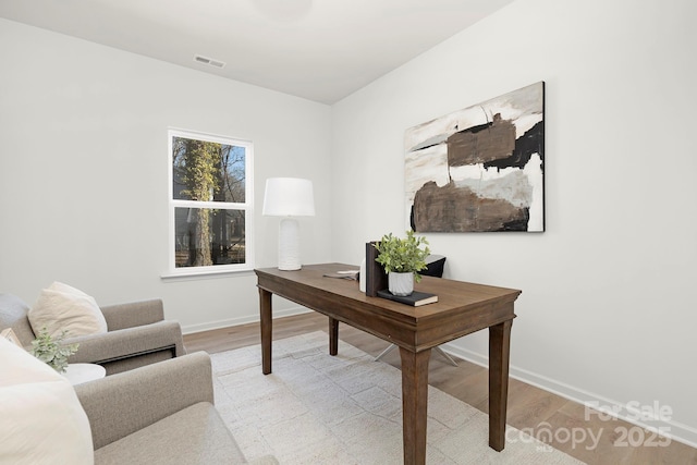 home office featuring light hardwood / wood-style floors