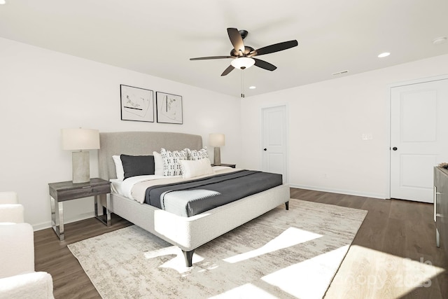 bedroom featuring ceiling fan and dark wood-type flooring