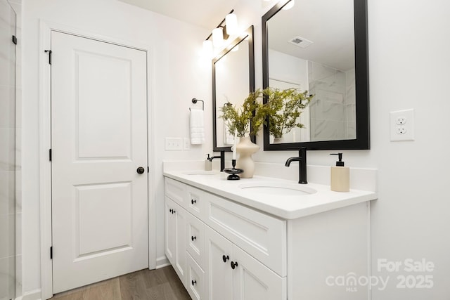 bathroom featuring hardwood / wood-style floors and vanity