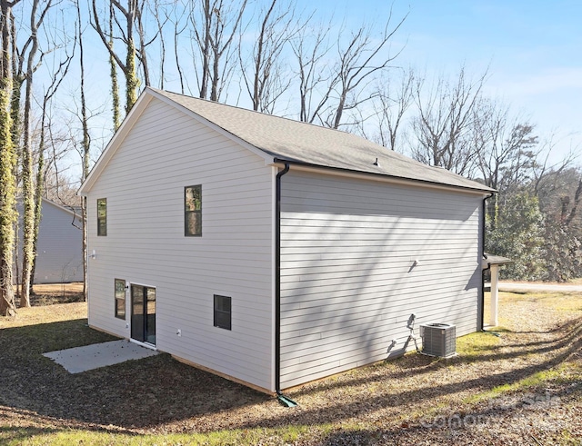 view of home's exterior with central AC