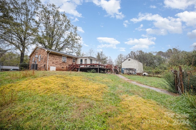 view of yard with a wooden deck