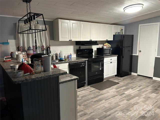 kitchen with black appliances, ventilation hood, light wood-type flooring, white cabinets, and kitchen peninsula